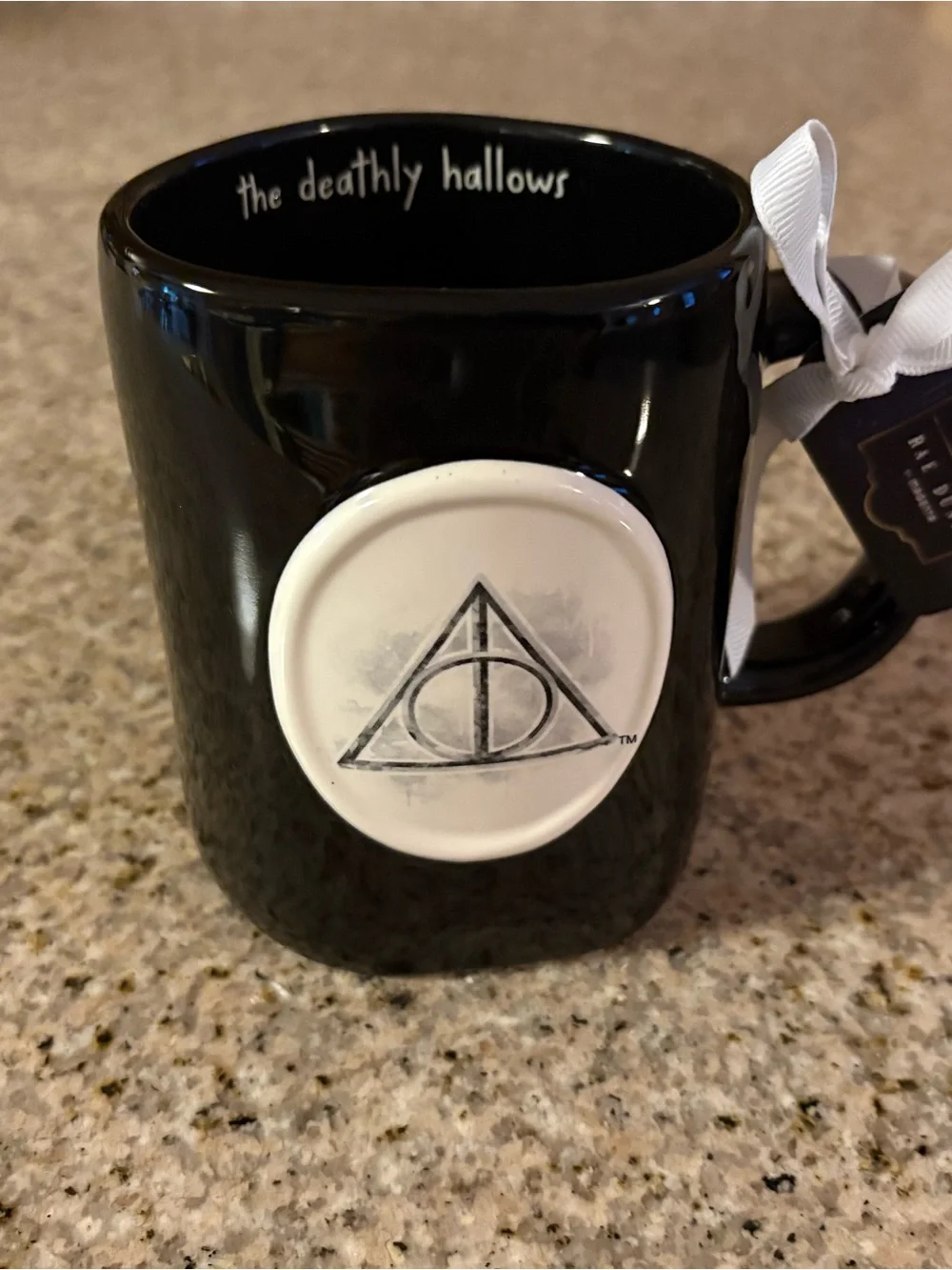 Rae Dunn Black Mug with White Deathly Hallows Medallion